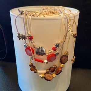 4 ADJUSTABLE STRING BRACELETS